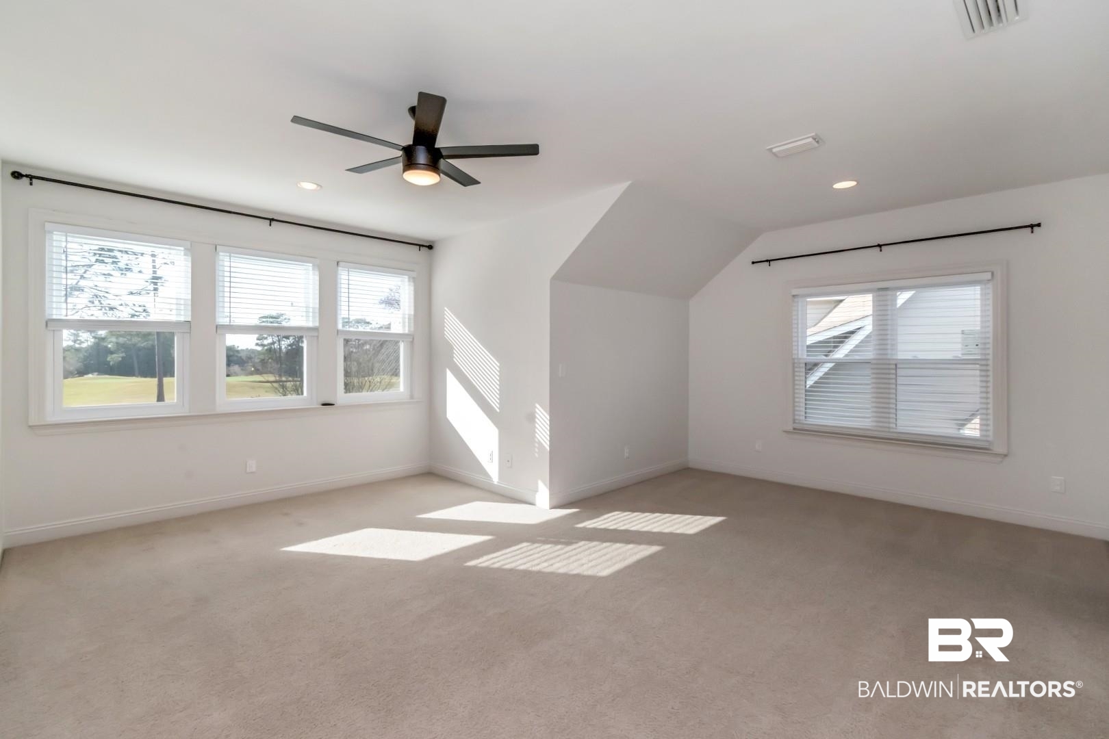 30585 Pine Court Daphne, AL 36527 - Photo 17 of 49 Bonus room featuring carpet, healthy amount of natural light, a ceiling fan, and lofted ceiling