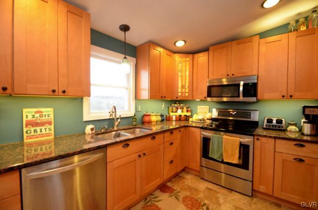 97 Old Beaver Run Road Lafayette, NJ 07848 - Photo 8 of 36 a kitchen with stainless steel appliances granite countertop a sink a stove and cabinets