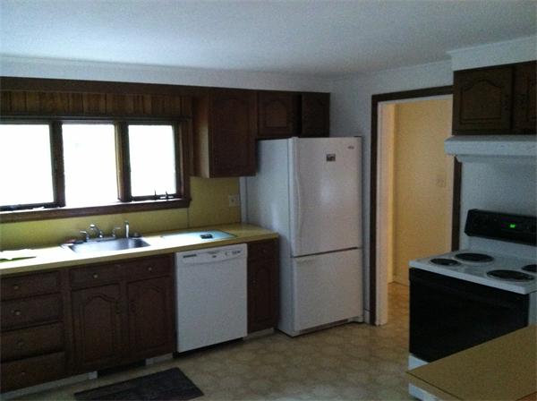 34 Wilkins Road Braintree, MA 02184 - Photo 11 of 12 a kitchen with a refrigerator and a sink