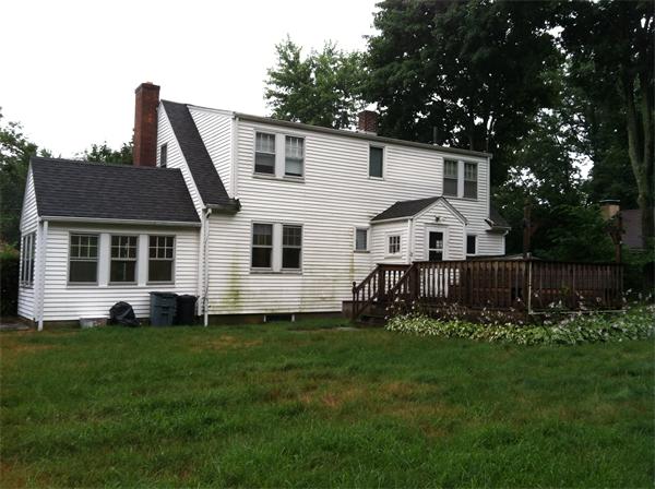 34 Wilkins Road Braintree, MA 02184 - Photo 3 of 12 a front view of a house with a yard and trees