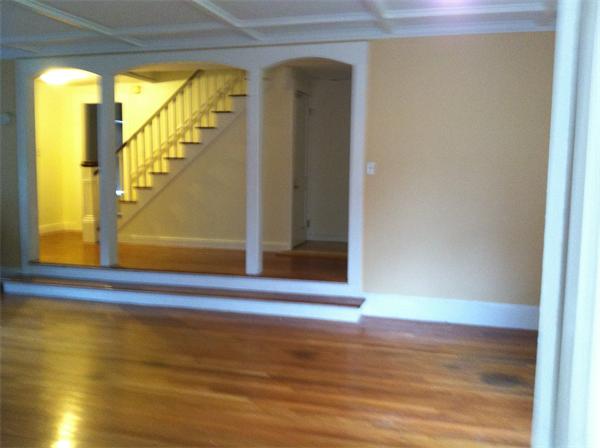 34 Wilkins Road Braintree, MA 02184 - Photo 5 of 12 a view of a room with wooden floor and windows