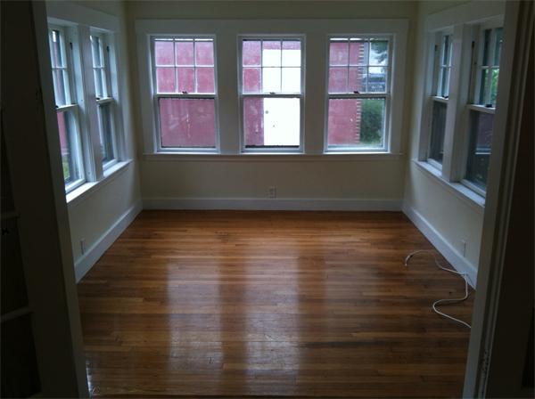 34 Wilkins Road Braintree, MA 02184 - Photo 6 of 12 a view of an empty room with wooden floor and a window