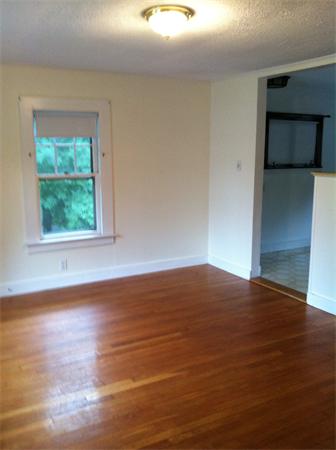 34 Wilkins Road Braintree, MA 02184 - Photo 7 of 12 a view of empty room with wooden floor and fan