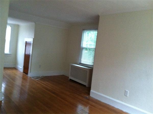 34 Wilkins Road Braintree, MA 02184 - Photo 8 of 12 an empty room with wooden floor and windows