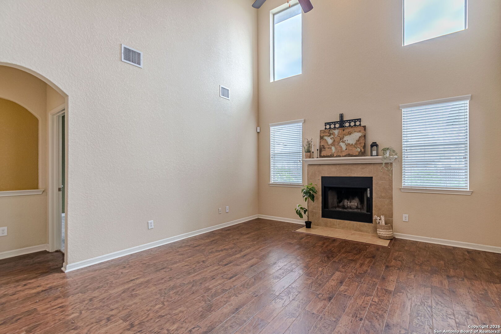 204 Wildcat Run Cibolo, TX 78108 - Photo 16 of 41 a view of an empty room with wooden floor fireplace and a window