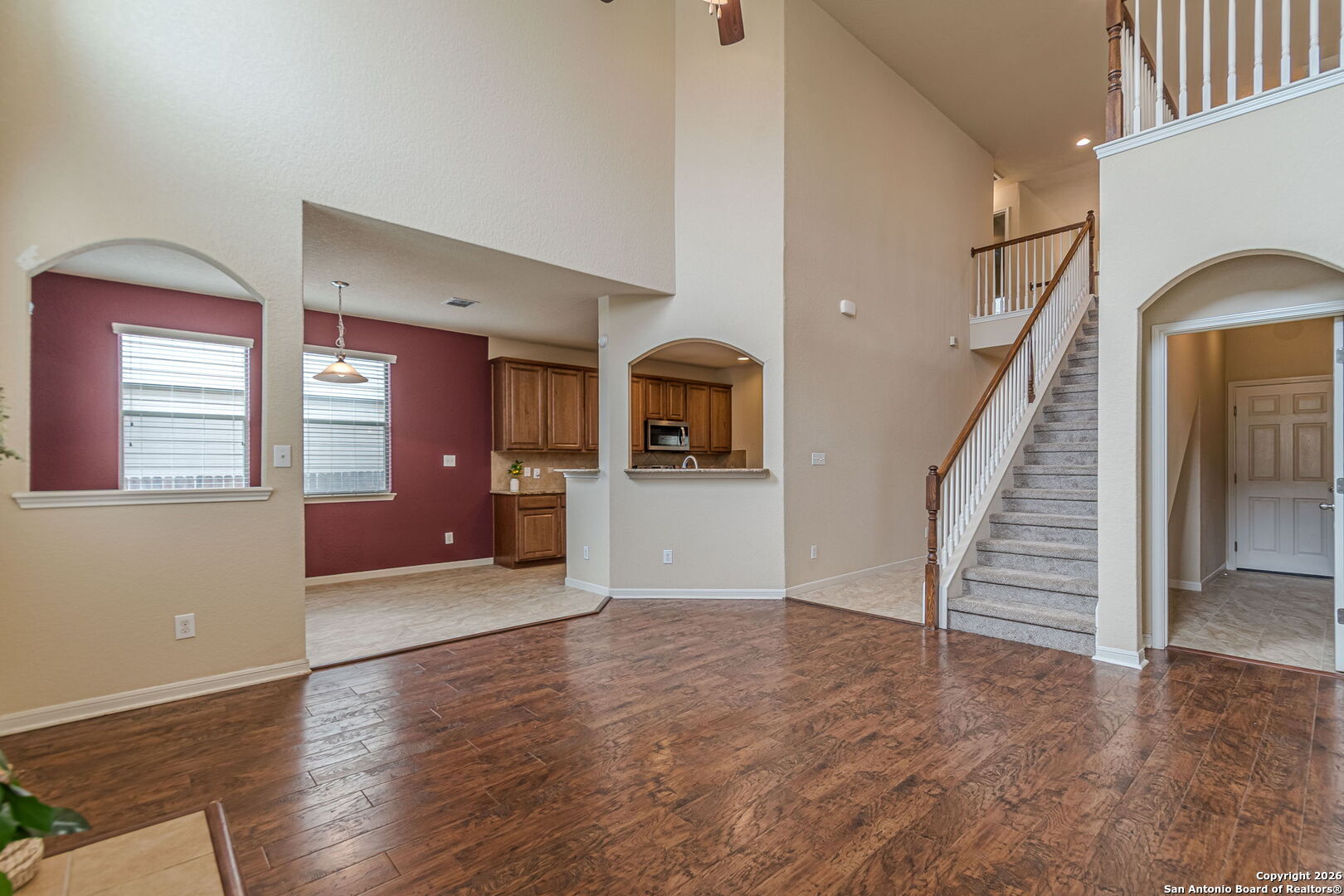 204 Wildcat Run Cibolo, TX 78108 - Photo 18 of 41 a view of a hallway with wooden floor and staircase