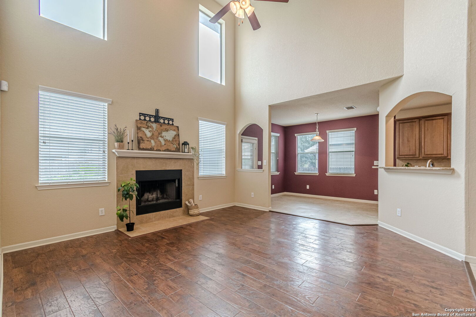204 Wildcat Run Cibolo, TX 78108 - Photo 19 of 41 a view of a livingroom with a fireplace wooden floor and windows