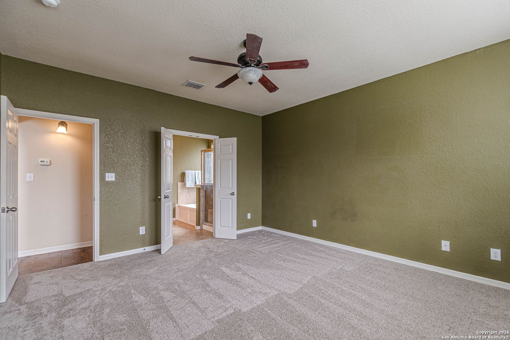 204 Wildcat Run Cibolo, TX 78108 - Photo 22 of 41 a view of an empty room with a ceiling fan