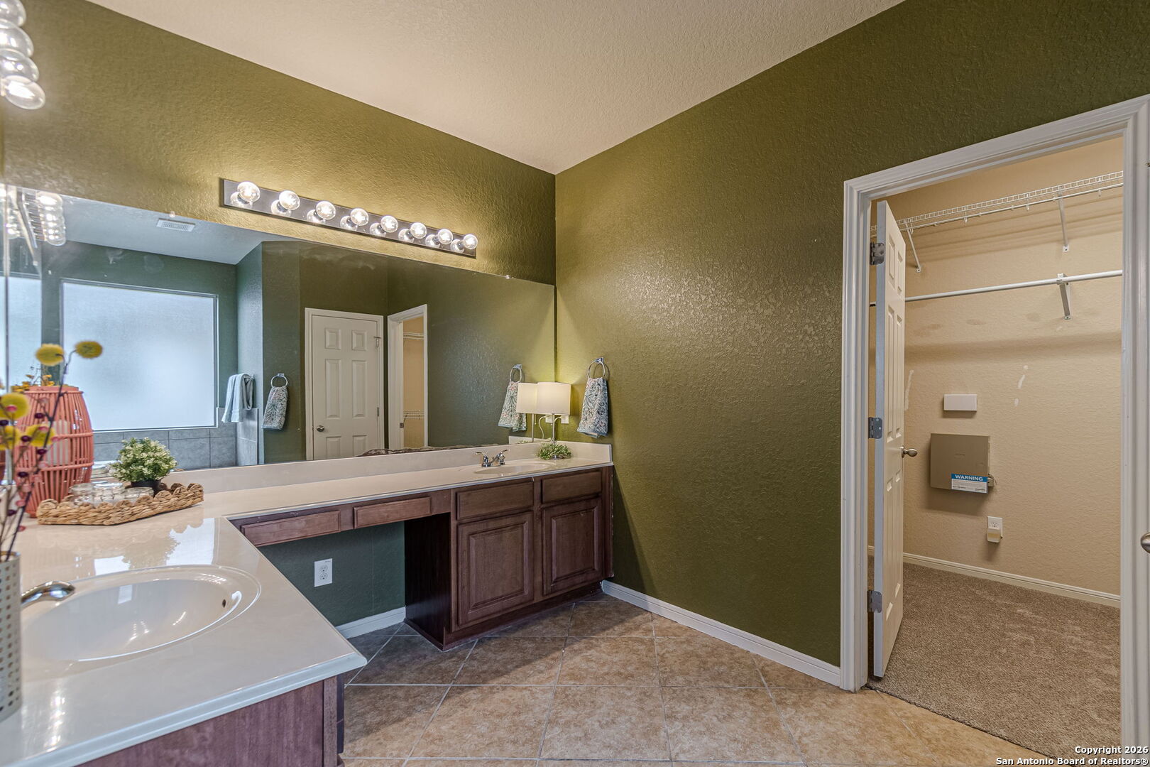 204 Wildcat Run Cibolo, TX 78108 - Photo 23 of 41 a spacious bathroom with a double vanity sink and a mirror