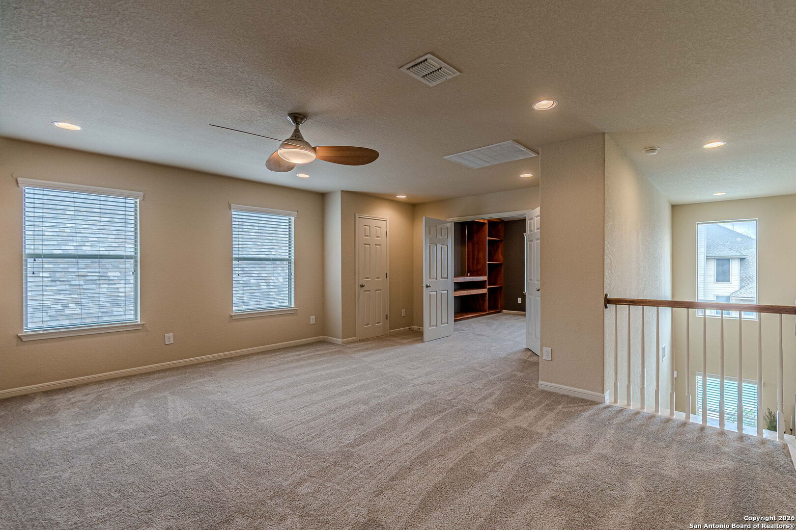 204 Wildcat Run Cibolo, TX 78108 - Photo 26 of 41 a view of an empty room with a window and a kitchen