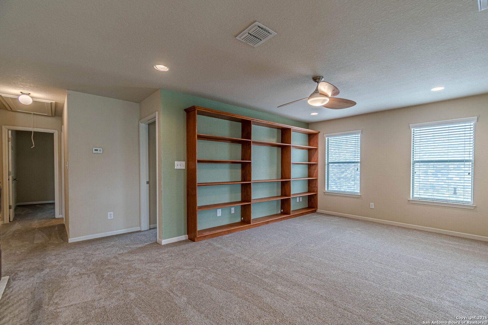 204 Wildcat Run Cibolo, TX 78108 - Photo 27 of 41 an empty room with a empty space and windows