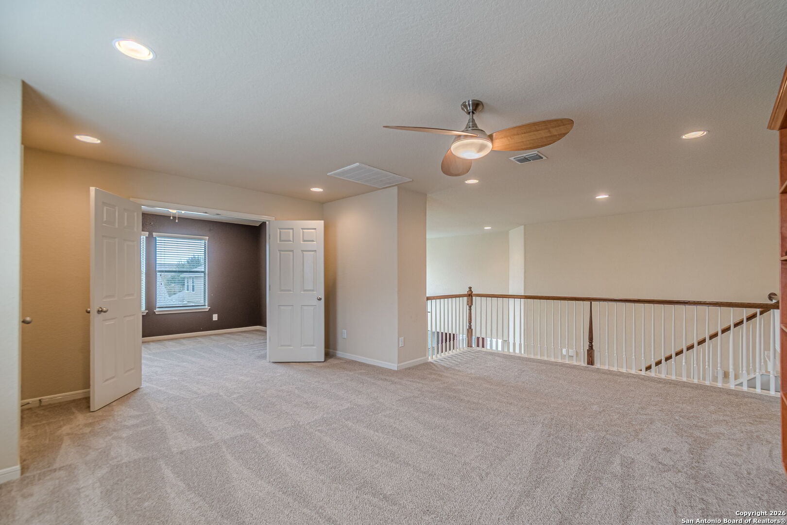 204 Wildcat Run Cibolo, TX 78108 - Photo 29 of 41 a view of an empty room with a ceiling fan