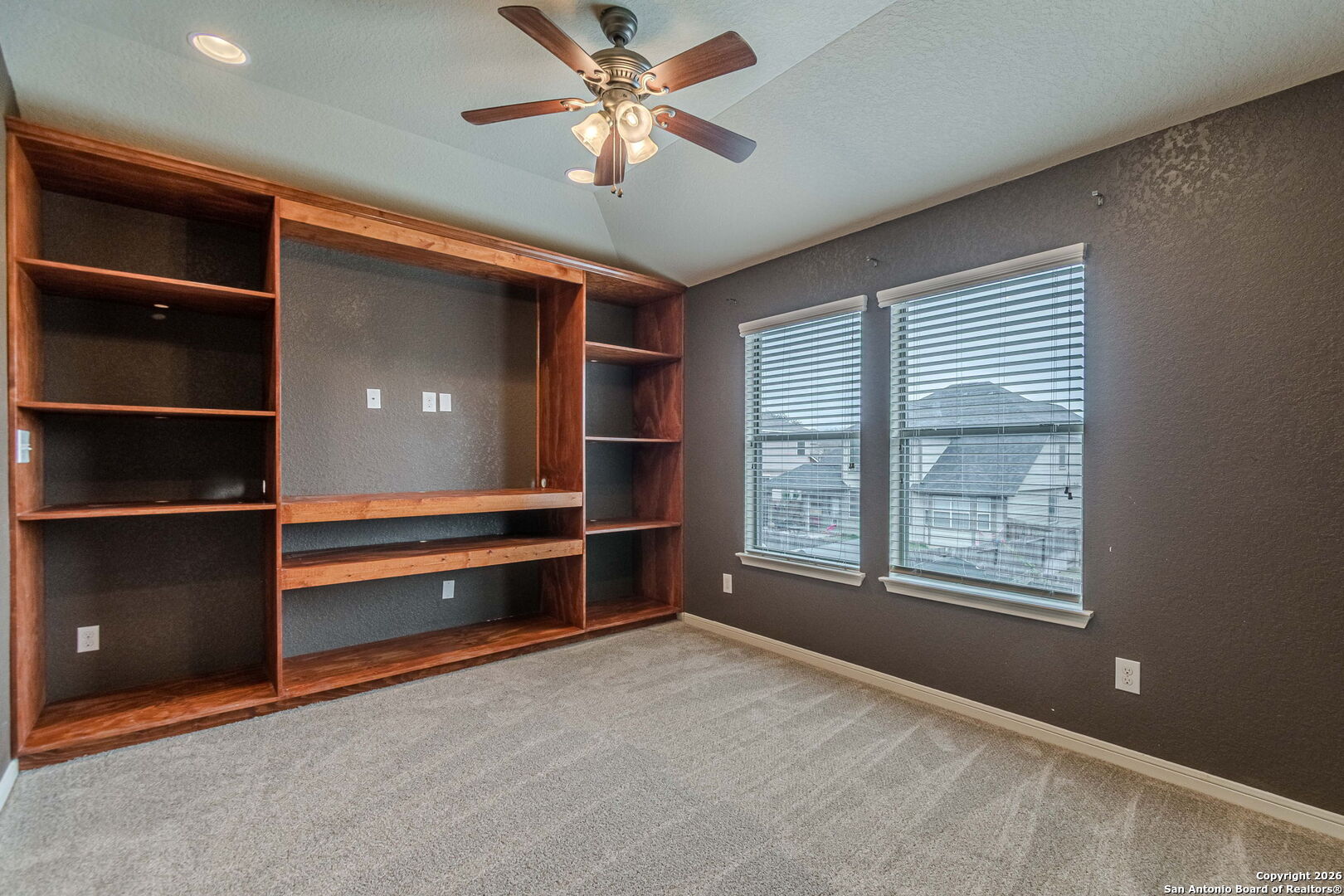 204 Wildcat Run Cibolo, TX 78108 - Photo 30 of 41 an empty room with windows and fan