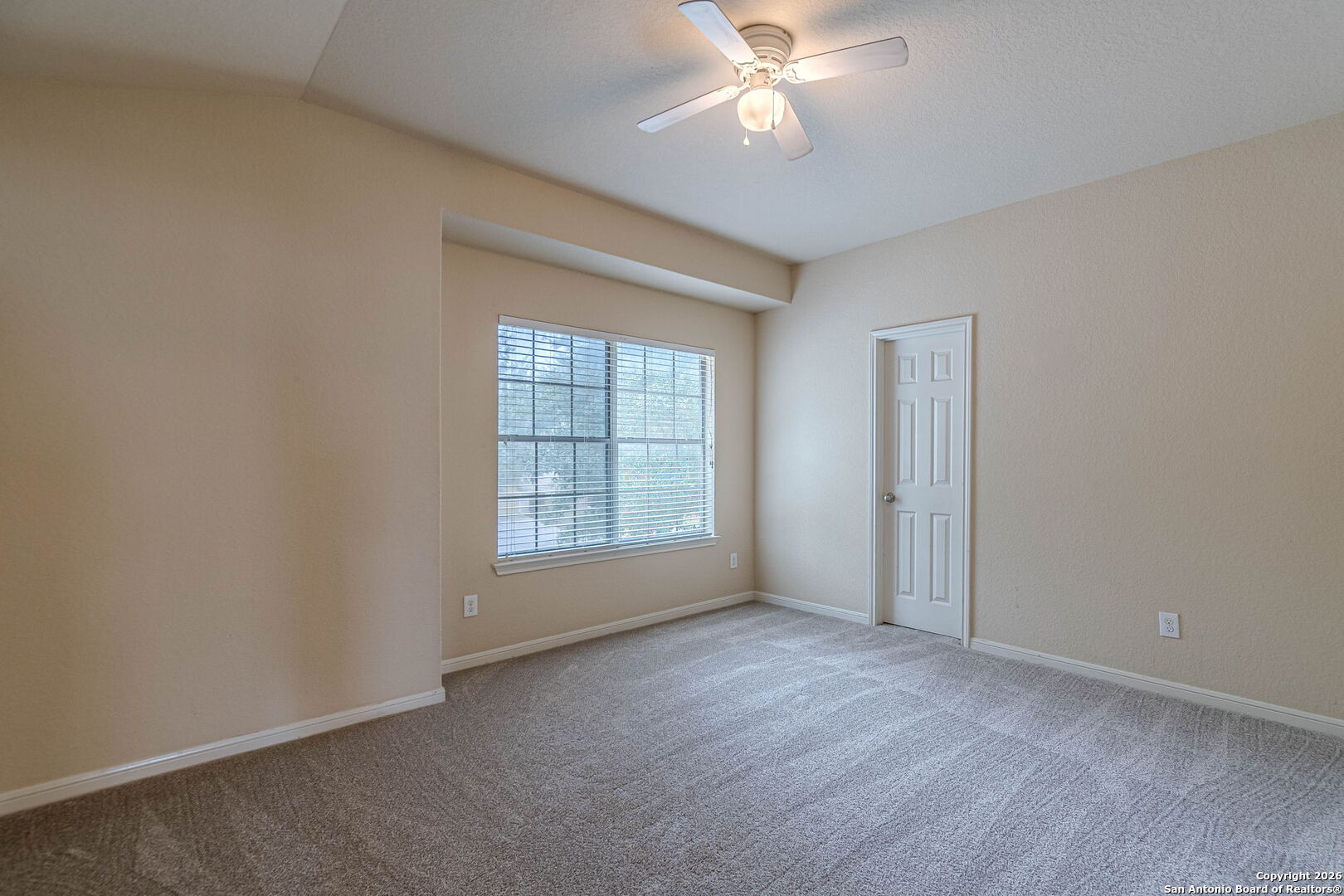 204 Wildcat Run Cibolo, TX 78108 - Photo 33 of 41 an empty room with chandelier fan and windows