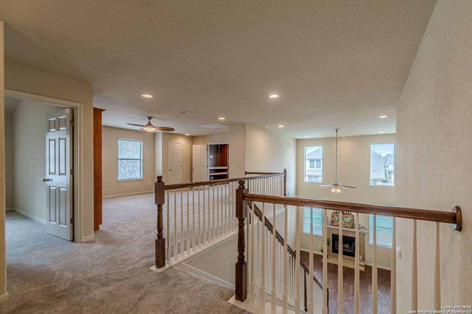 204 Wildcat Run Cibolo, TX 78108 - Photo 35 of 41 a view of a hallway with windows and stairs