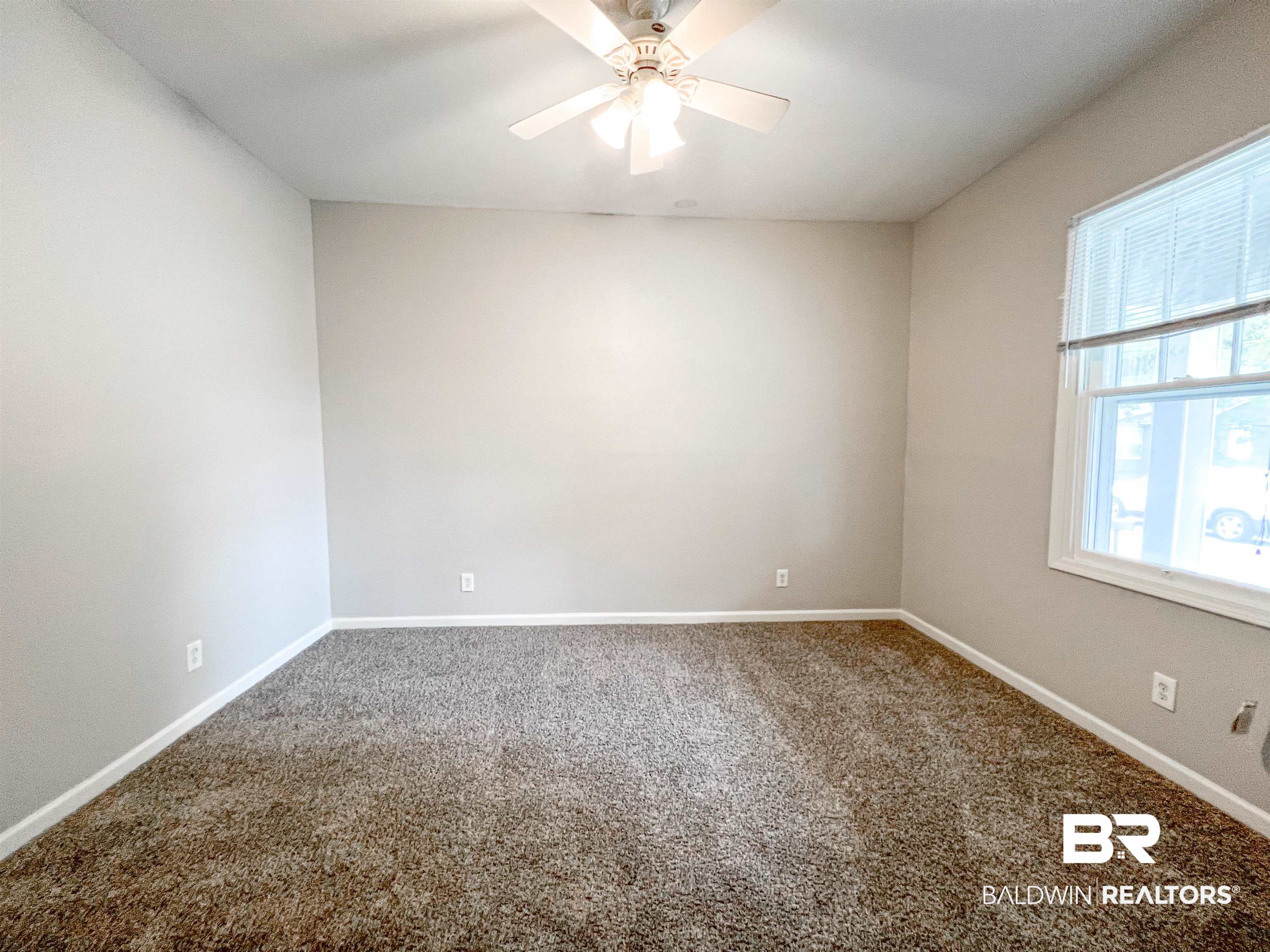 1164 Seneca Street Mobile, AL 36605 - Photo 17 of 22 Carpeted empty room with baseboards and a ceiling fan