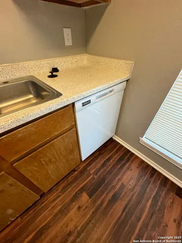 a white refrigerator freezer sitting inside of a kitchen