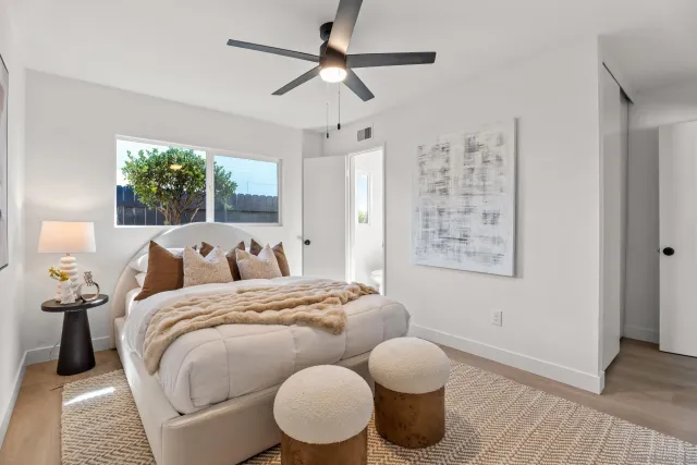 a bed room with bed and a window