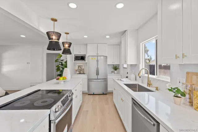 a kitchen with a sink stove and refrigerator