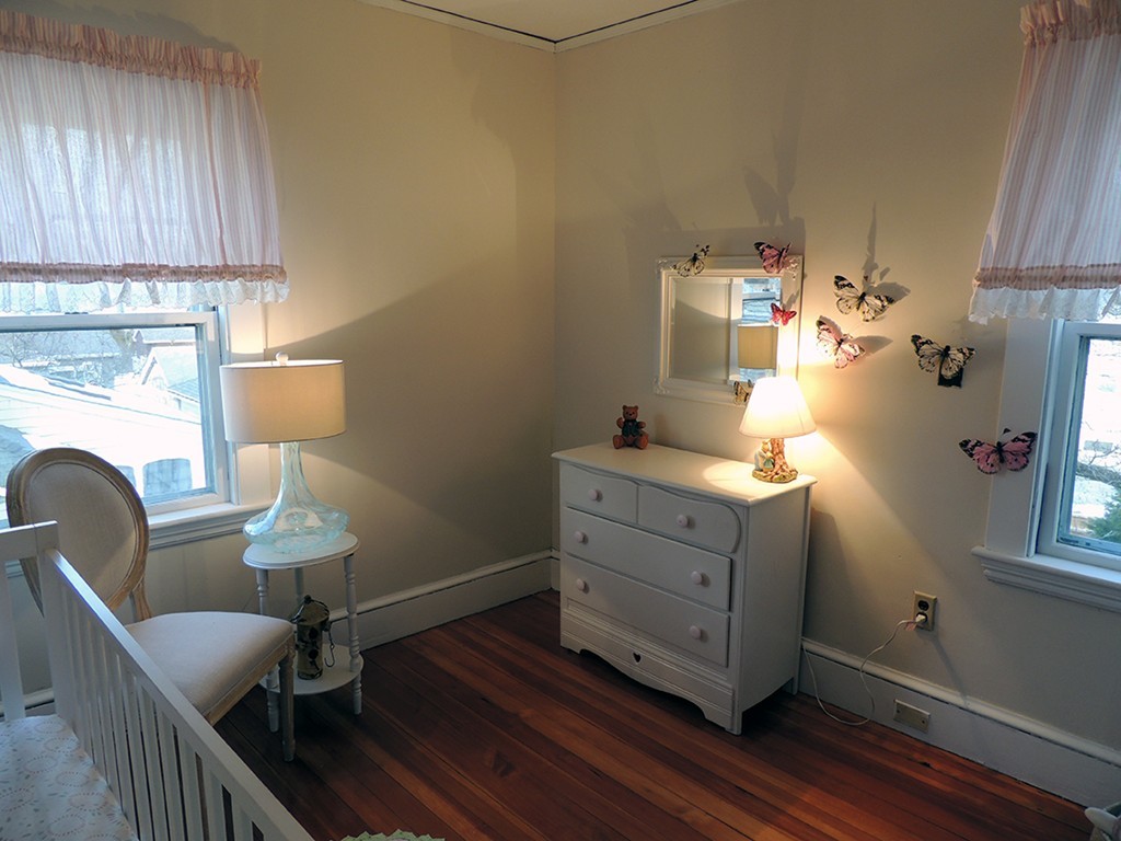 22 Symmes Road Winchester, MA 01890 - Photo 10 of 20 a room with furniture and wooden floor