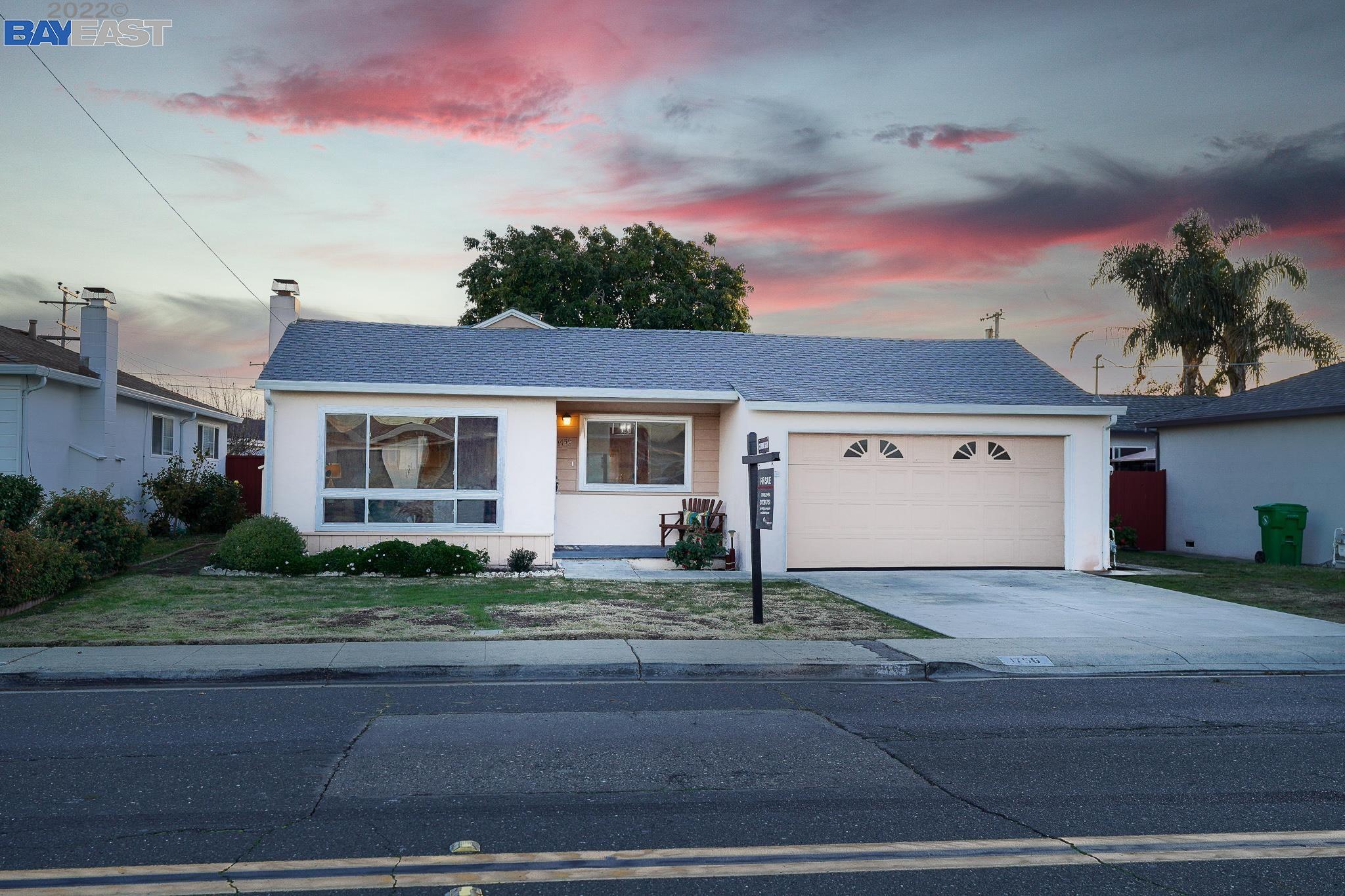 1756 Bockman Road San Lorenzo, CA 94580 - Photo 1 of 1 a front view of a house with a yard and garage