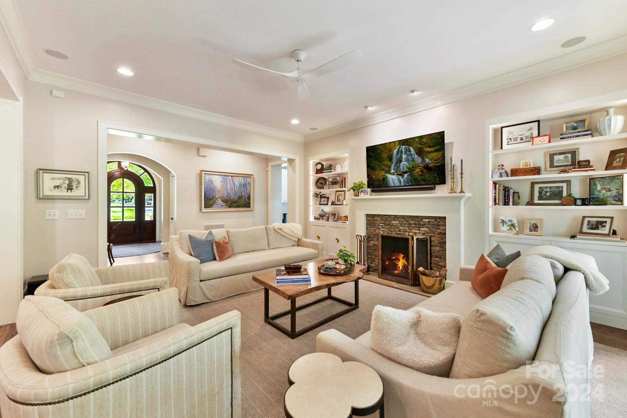 3201 Wickersham Road Charlotte, NC 28211 - Photo 13 of 43 a living room with furniture a flat screen tv and a fireplace