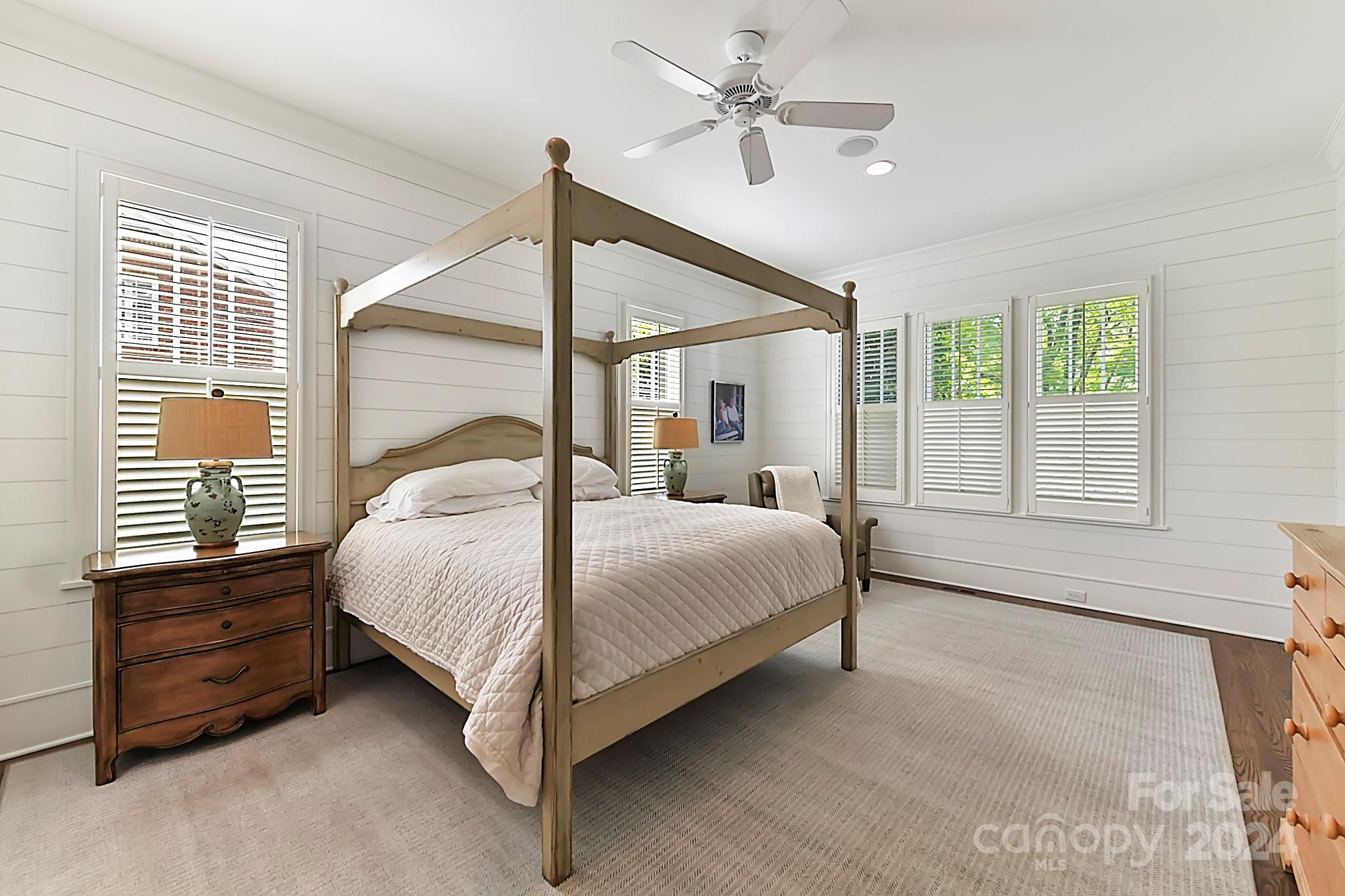 3201 Wickersham Road Charlotte, NC 28211 - Photo 20 of 43 a bedroom with a bed chandelier and a window