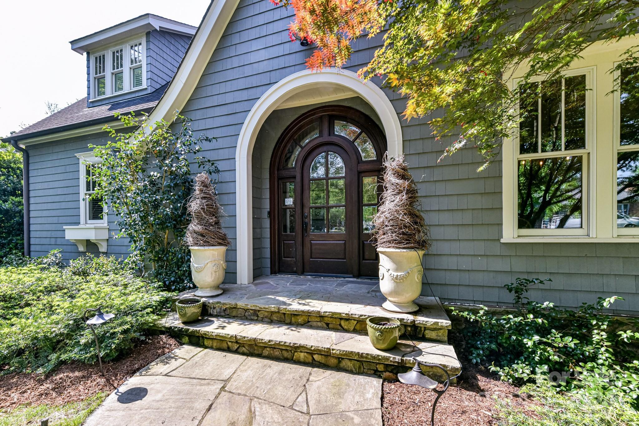 3201 Wickersham Road Charlotte, NC 28211 - Photo 2 of 43 a front view of a house with a garden