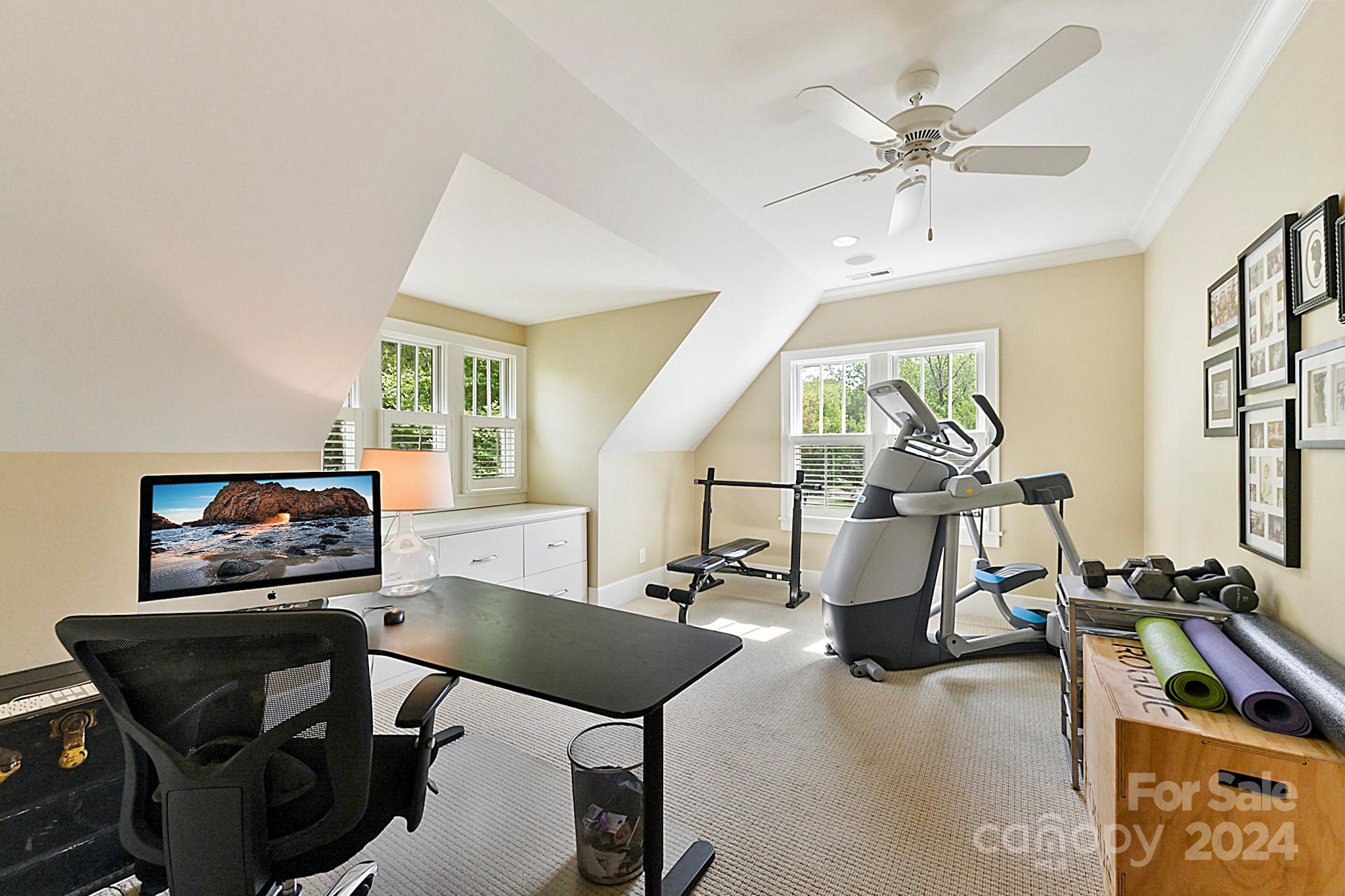 3201 Wickersham Road Charlotte, NC 28211 - Photo 26 of 43 a room with gym equipment and windows