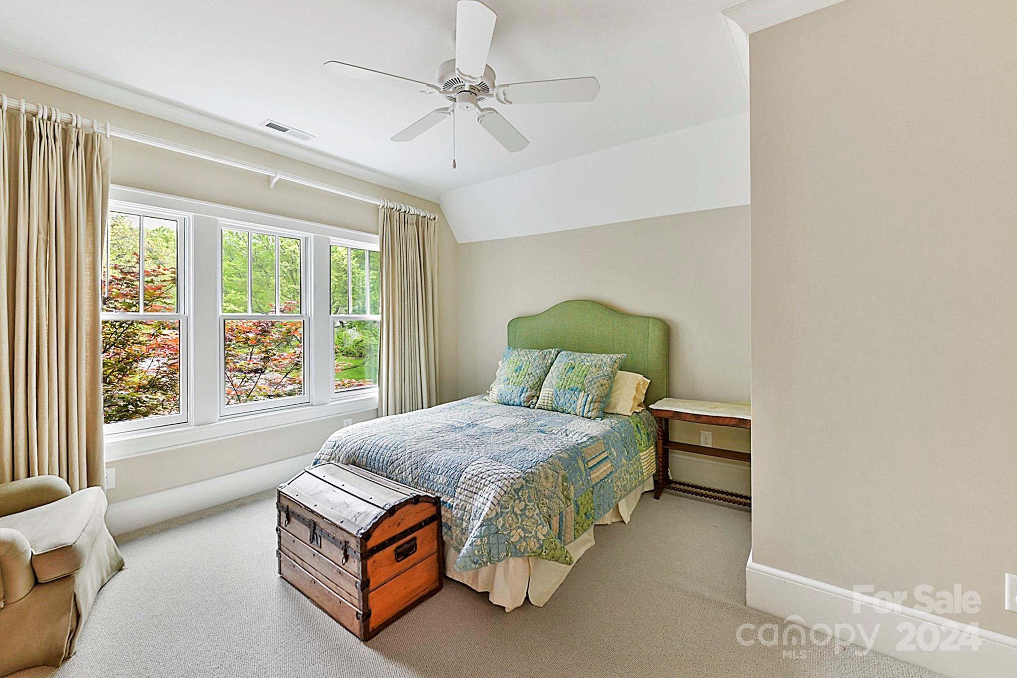 3201 Wickersham Road Charlotte, NC 28211 - Photo 27 of 43 a bedroom with a bed lamp and a window