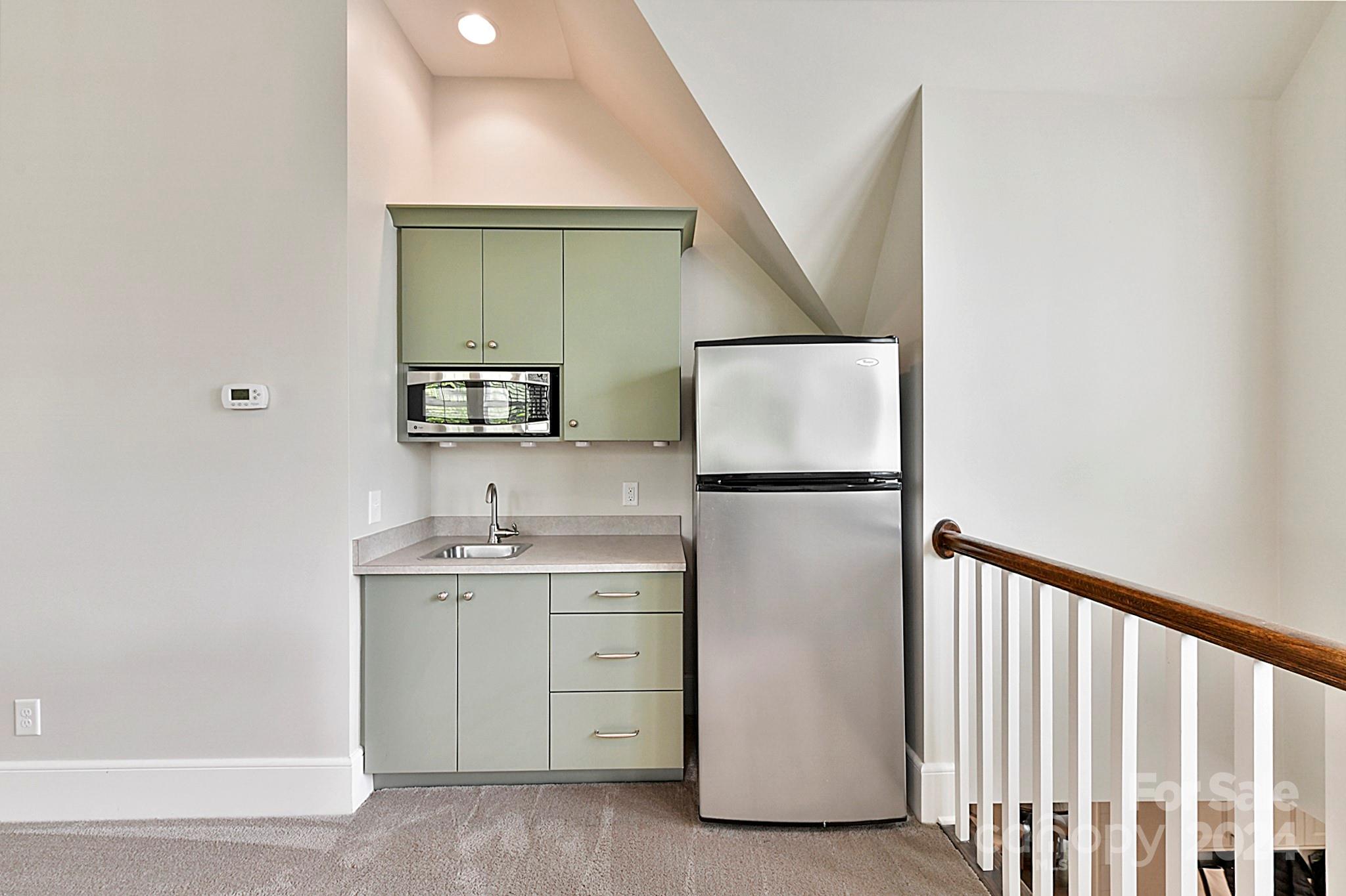 3201 Wickersham Road Charlotte, NC 28211 - Photo 30 of 43 a utility room with cabinets washer and dryer