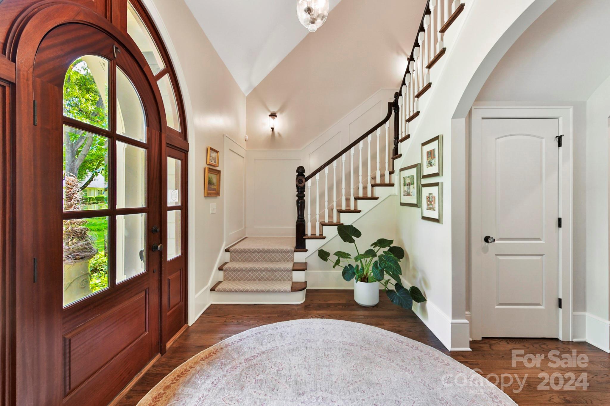 3201 Wickersham Road Charlotte, NC 28211 - Photo 3 of 43 a view of an entryway with wooden floor and a potted plant