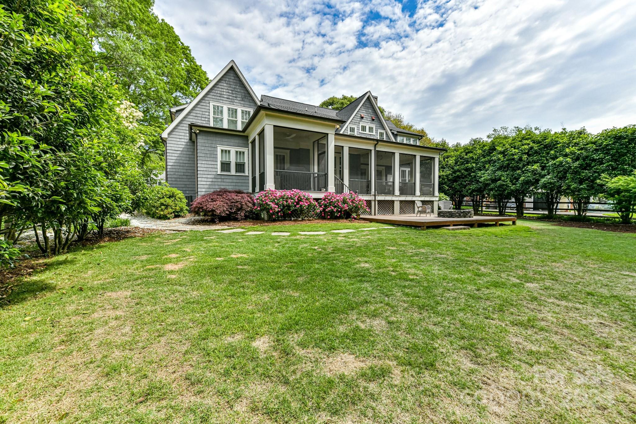 3201 Wickersham Road Charlotte, NC 28211 - Photo 39 of 43 a front view of a house with a garden and trees