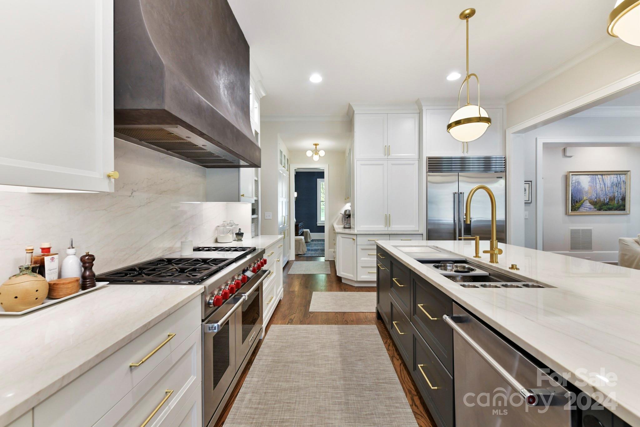 3201 Wickersham Road Charlotte, NC 28211 - Photo 8 of 43 a kitchen with kitchen island stainless steel appliances a stove sink and cabinets