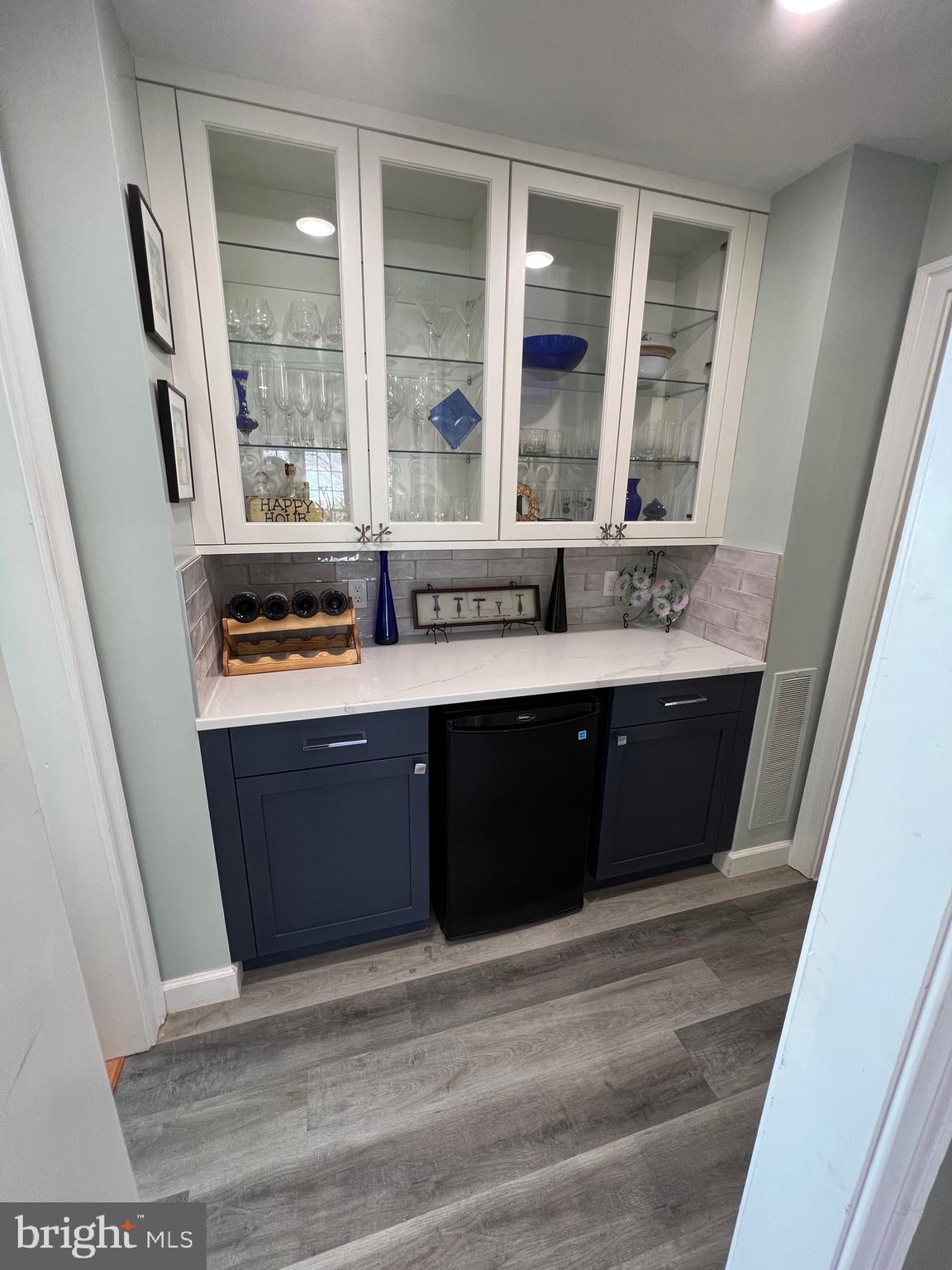 9706 Hidden Valley Road Vienna, VA 22181 - Photo 23 of 43 a room with stainless steel appliances granite countertop a sink and a wooden cabinets