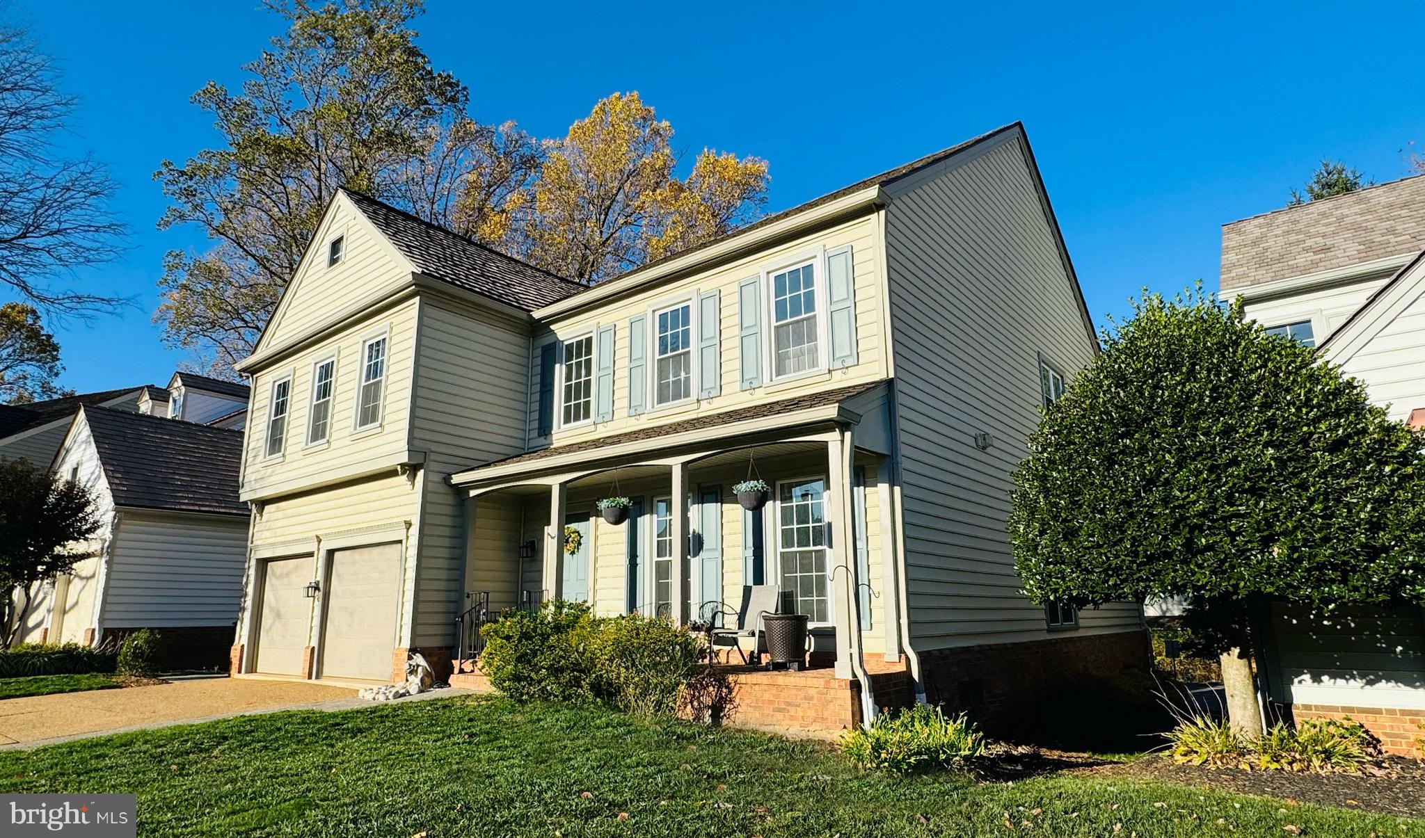9706 Hidden Valley Road Vienna, VA 22181 - Photo 3 of 43 a front view of a house with garden