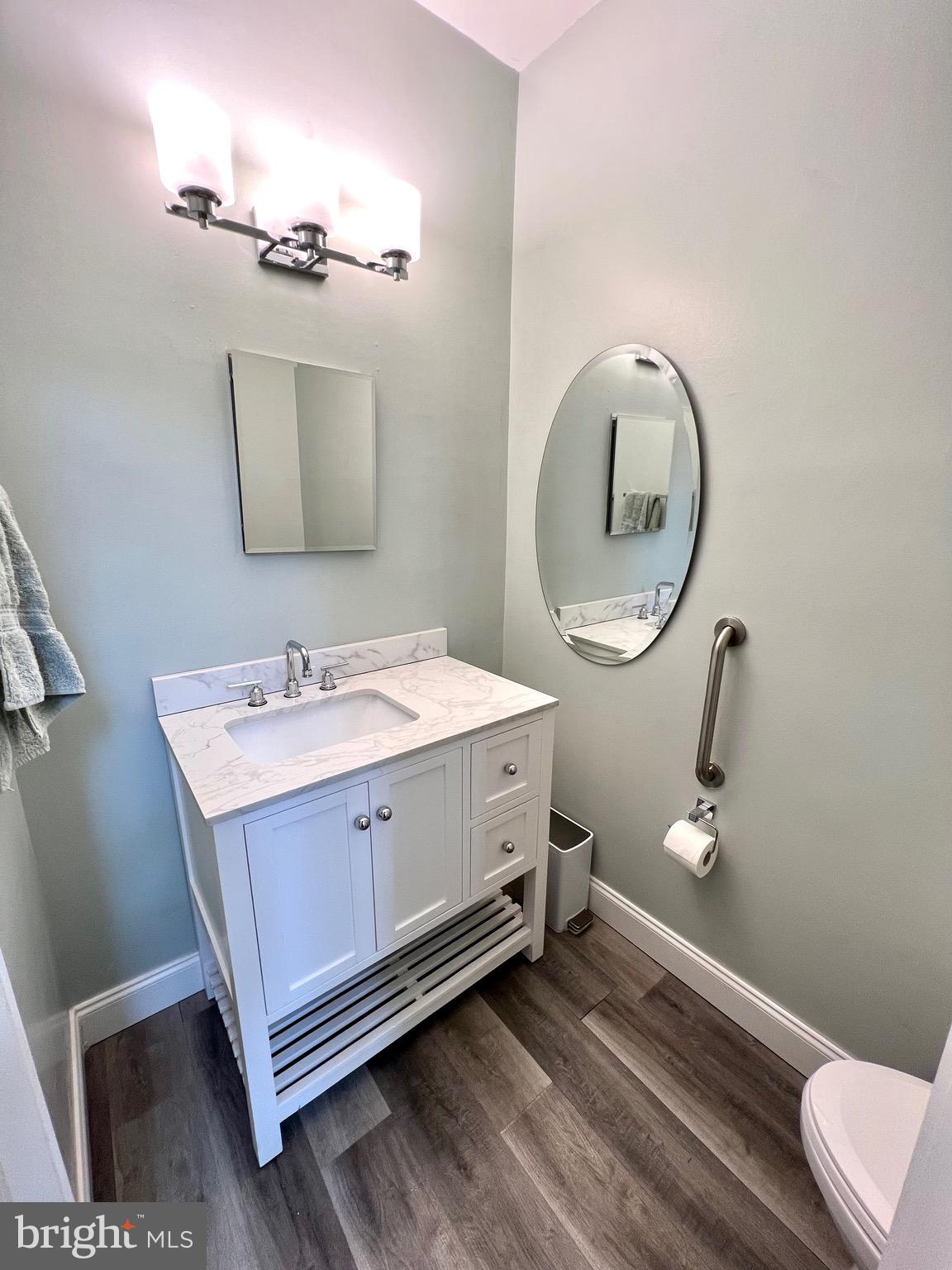 9706 Hidden Valley Road Vienna, VA 22181 - Photo 30 of 43 a bathroom with a sink mirror and vanity