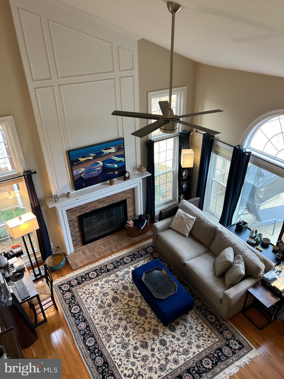 9706 Hidden Valley Road Vienna, VA 22181 - Photo 32 of 43 a living room with furniture and a fireplace