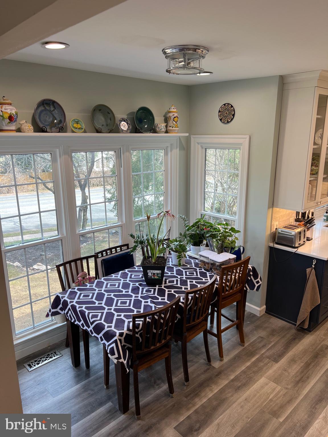 9706 Hidden Valley Road Vienna, VA 22181 - Photo 34 of 43 a view of a dining room with furniture window and wooden floor