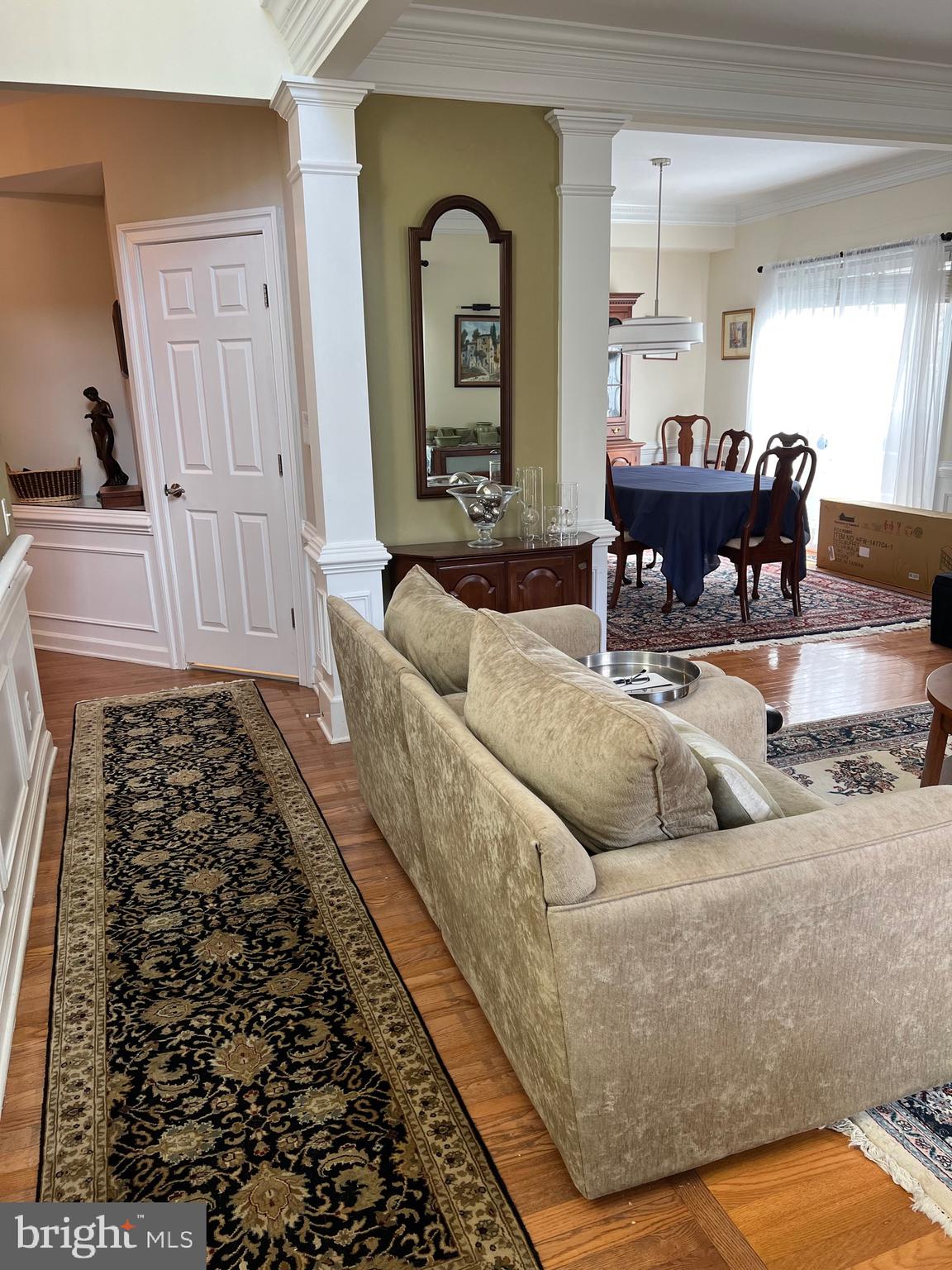 9706 Hidden Valley Road Vienna, VA 22181 - Photo 35 of 43 a living room with furniture and a large mirror