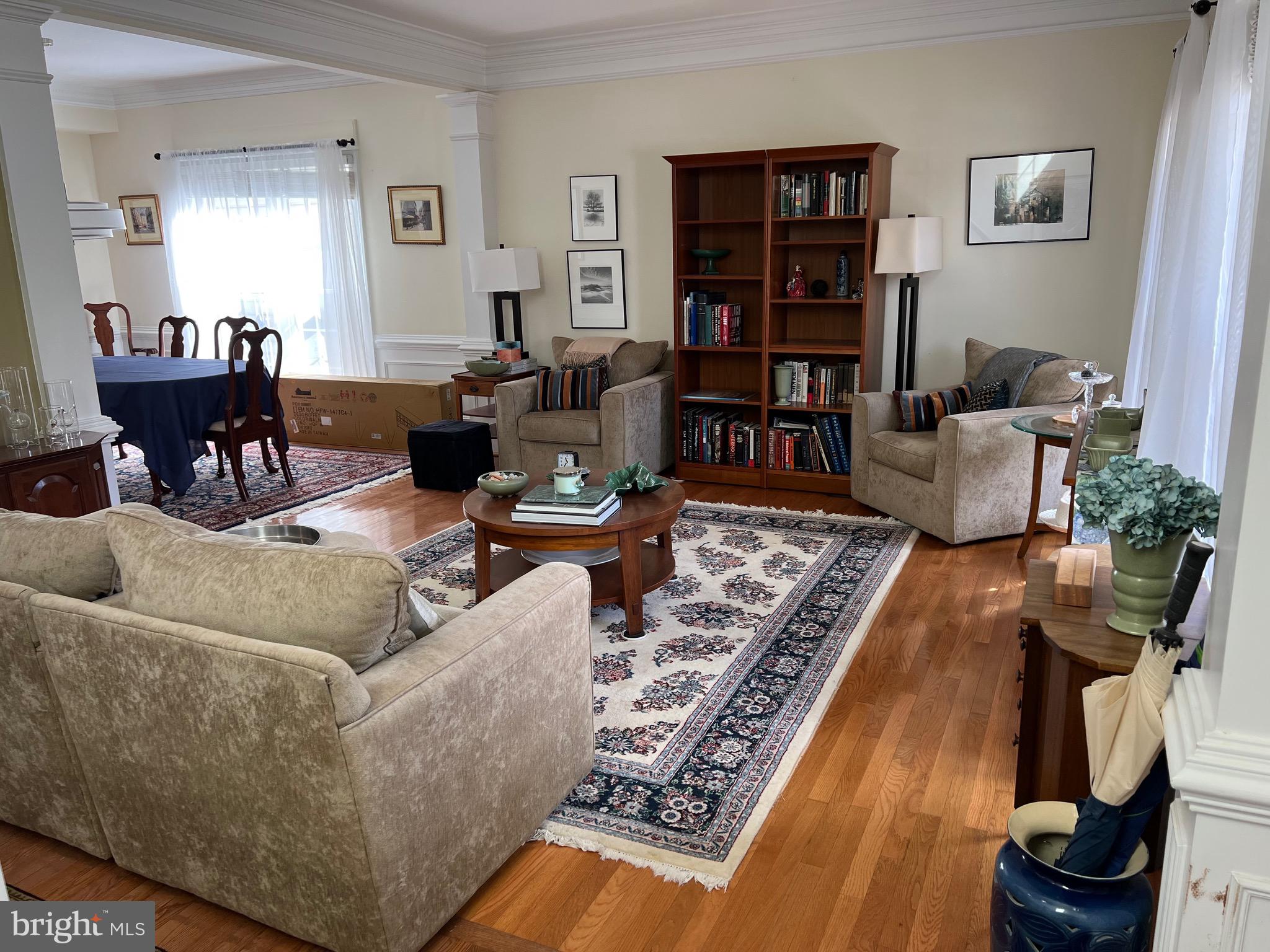 9706 Hidden Valley Road Vienna, VA 22181 - Photo 36 of 43 a living room with furniture and a book shelf