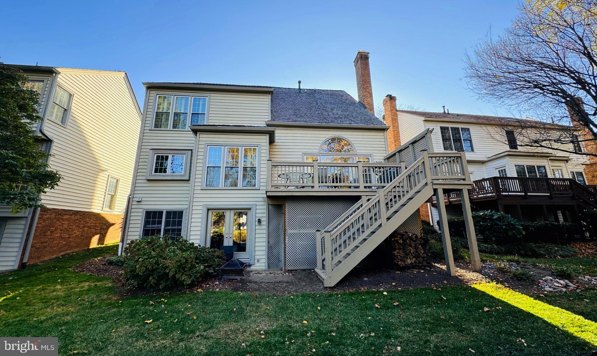 9706 Hidden Valley Road Vienna, VA 22181 - Photo 6 of 43 a front view of a house with yard and porch