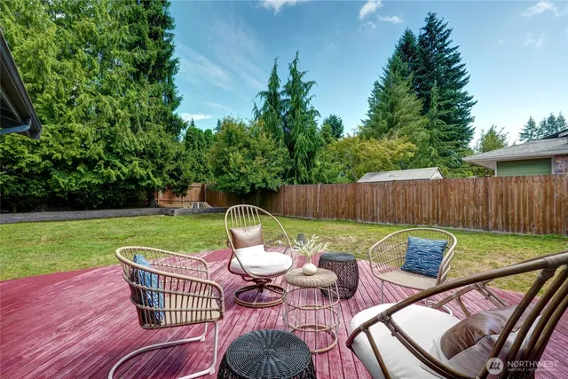 a view of a table and chairs on the deck