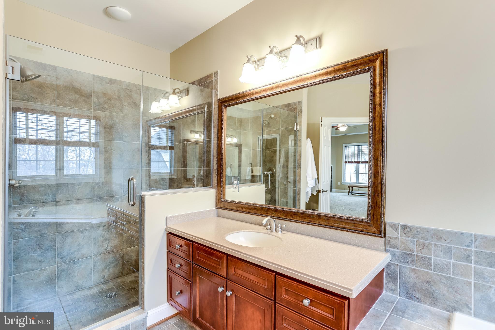 7673 Colonial Beach Road Pasadena, MD 21122 - Photo 52 of 86 Shower with frameless glass doors