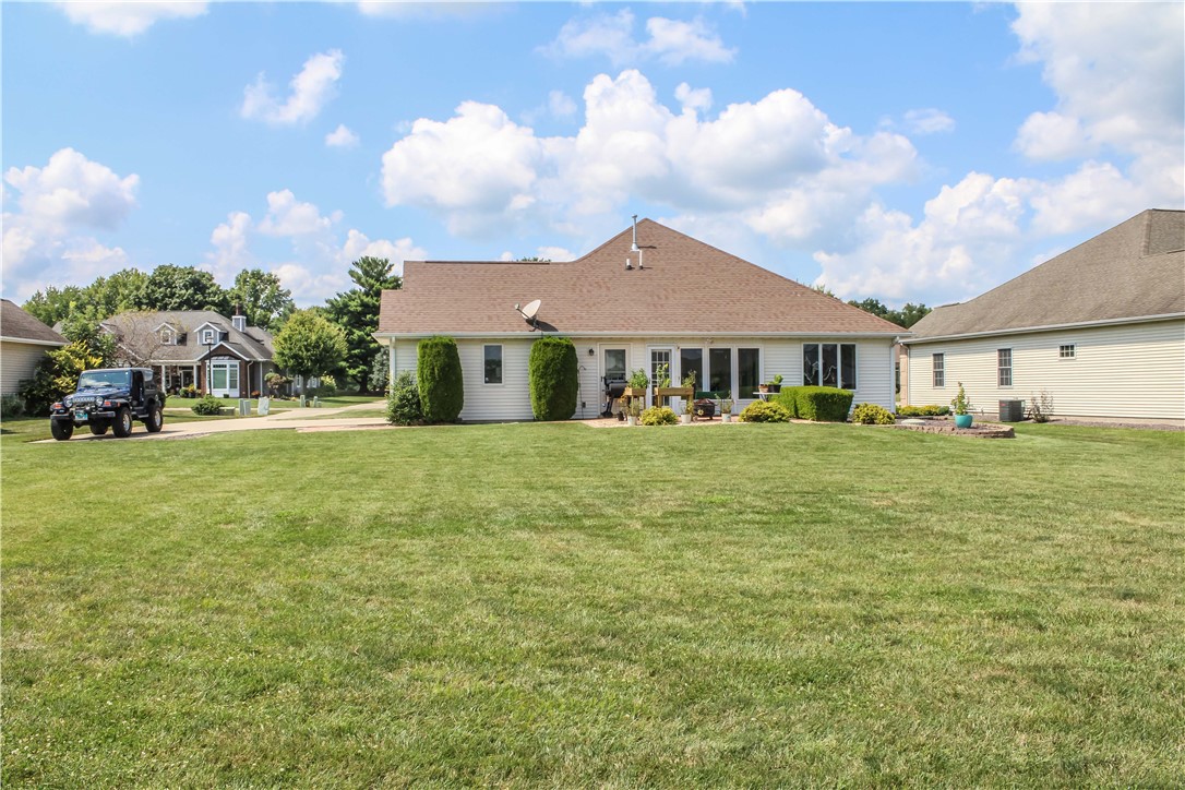 9 South Country Club Road Mattoon, IL 61938 - Photo 4 of 20 a front view of a house with a yard