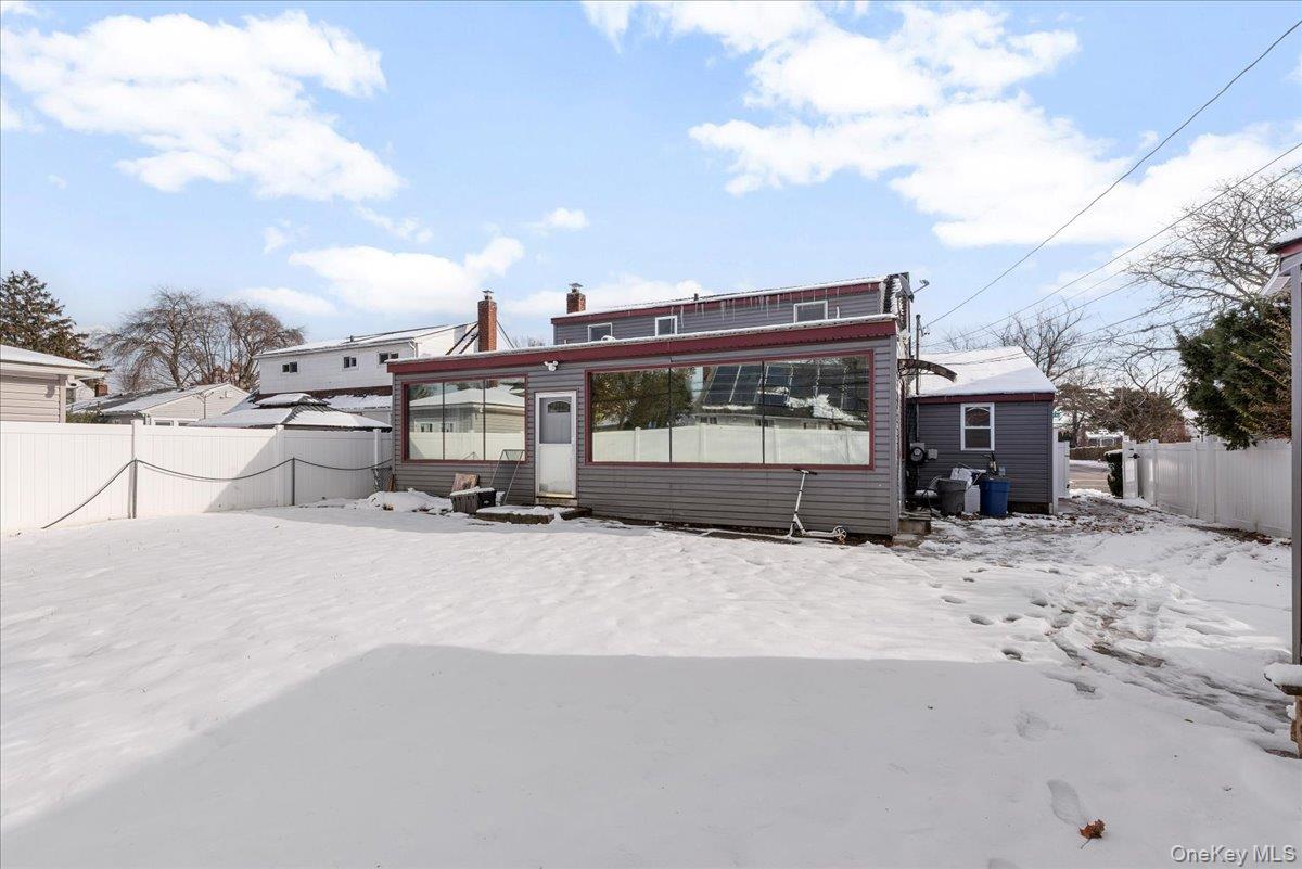 Snow covered house with entry steps