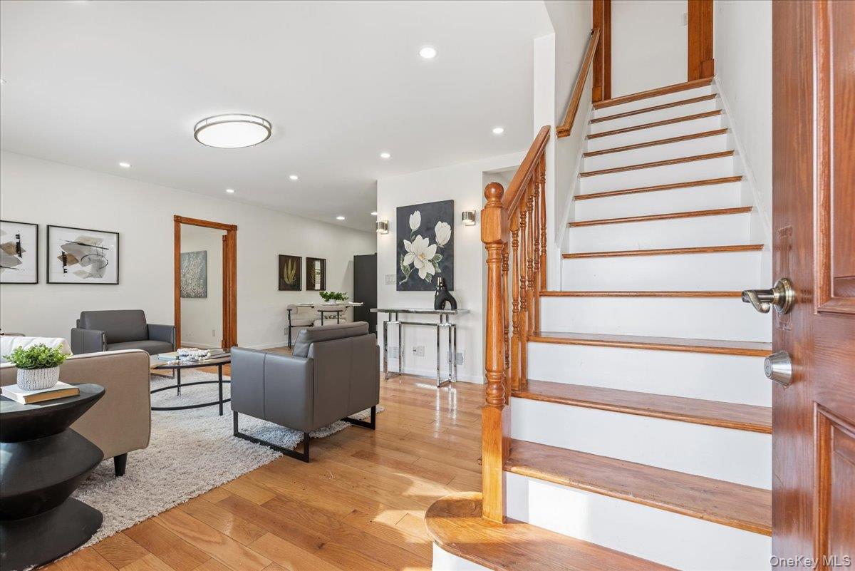 85 Briarcliff Road Westbury, NY 11590 - Photo 2 of 31 Stairs with hardwood / wood-style flooring and recessed lighting