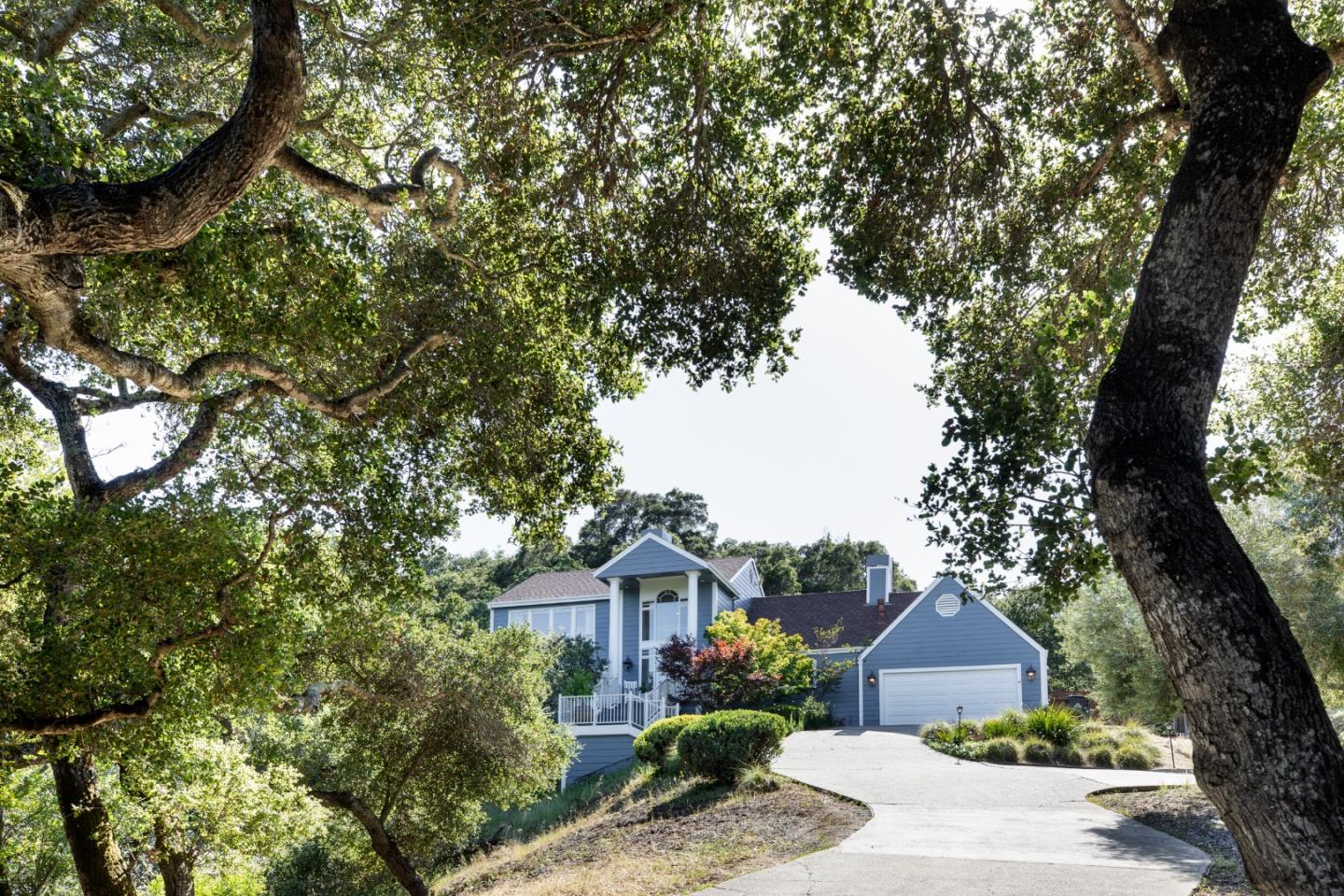 345 Harcross Road Woodside, CA 94062 - Photo 1 of 37 a front view of a house with a garden