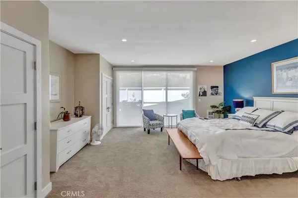 a living room with furniture and windows
