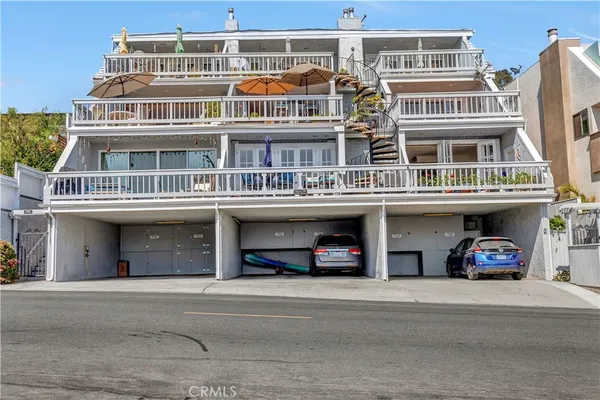 a view of a garage with cars